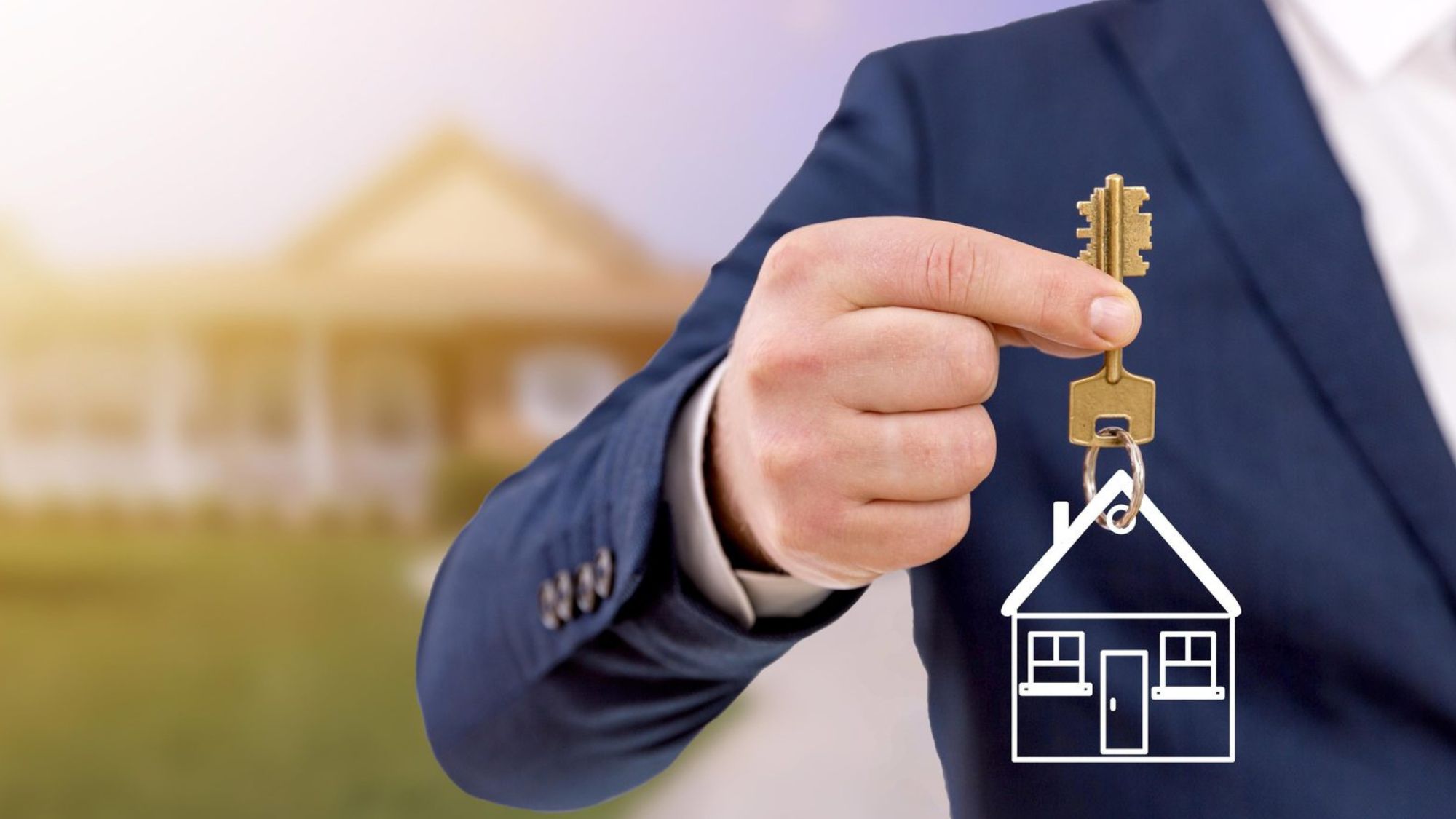 A man in a suit holding a key to a house, symbolizing the importance of buying property through real estate agencies