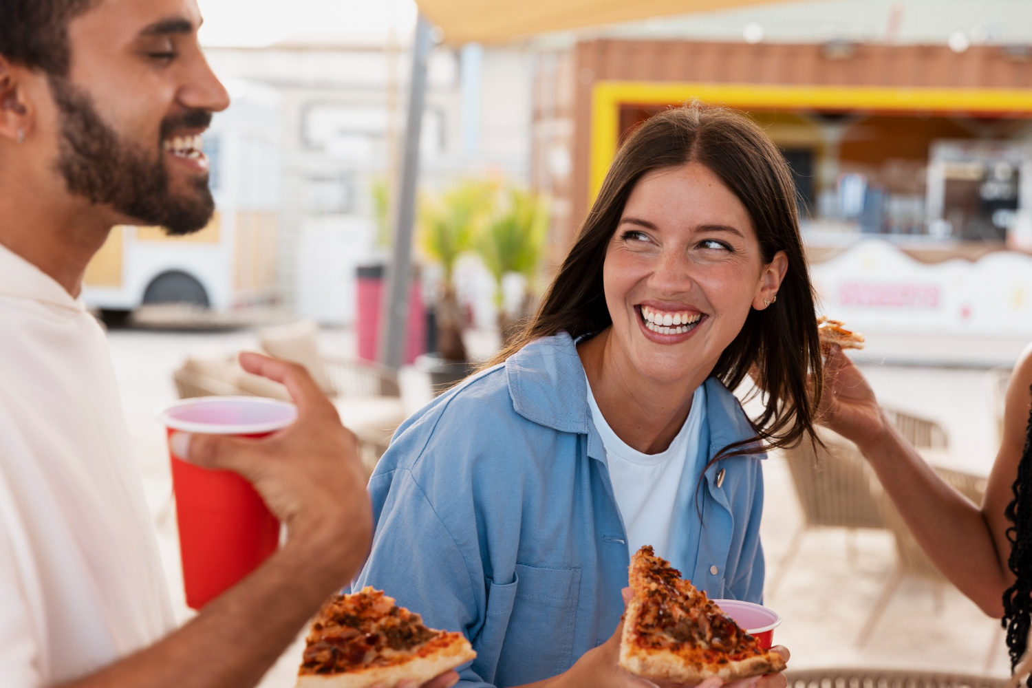 Smiley couple eating fast food