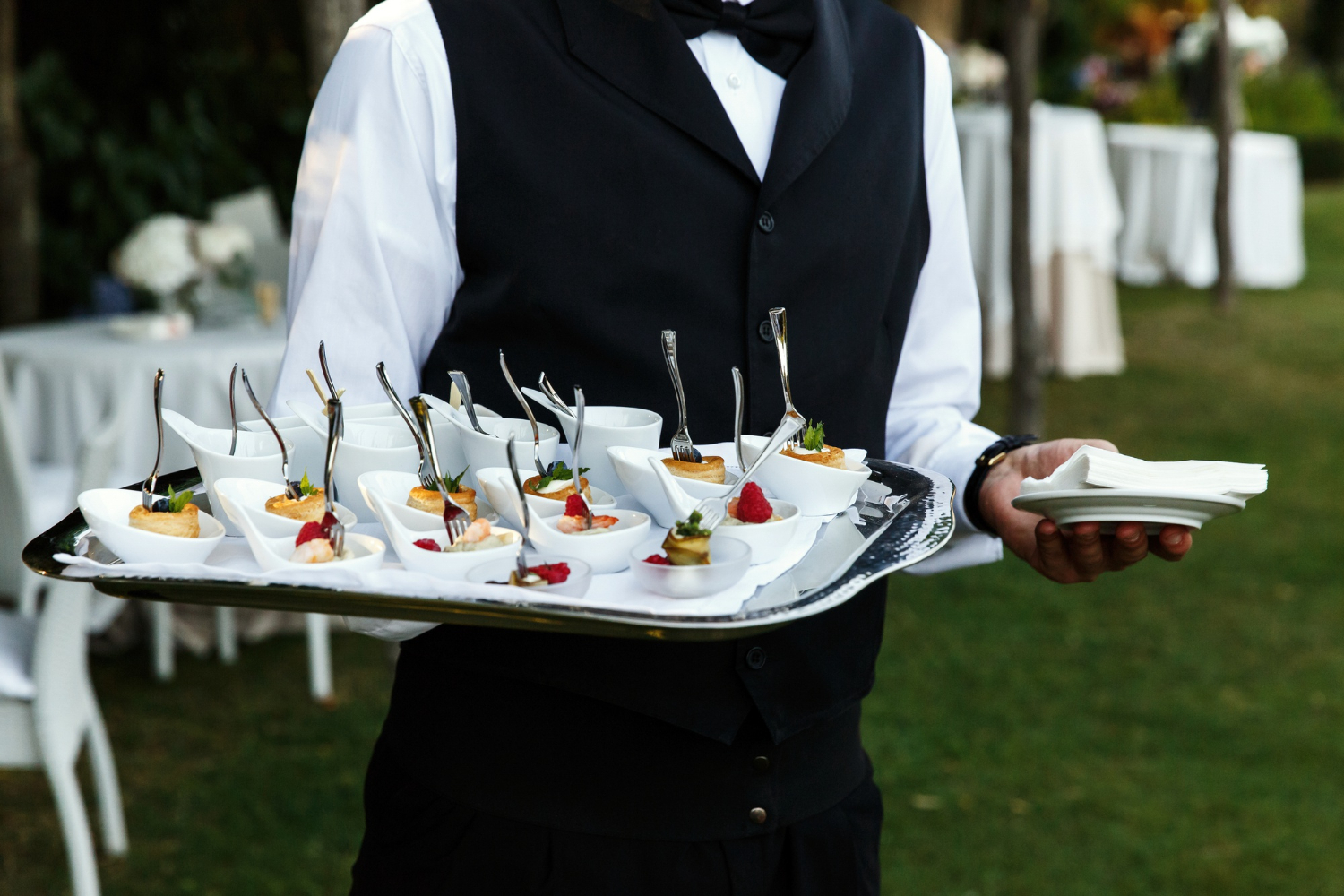 Waiter providing catering services at wedding